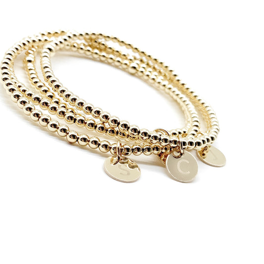 14K gold filled bead bracelet, classic jewelry, timeless elegance, sophisticated accessory, lustrous gold beads, versatile design, staple bracelet, minimalist luxury, glamorous jewelry