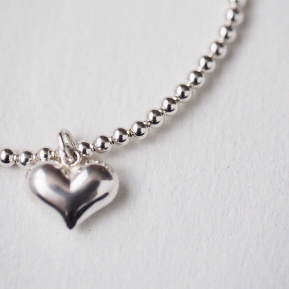 Upgrade your style with our Silver Charm Bracelet, perfect for Valentine's Day. Featuring a stunning heart design, this bracelet will add a touch of elegance and love to any outfit. Made with high-quality materials, it's the perfect gift for your loved ones. Order now and make your special someone feel even more special.