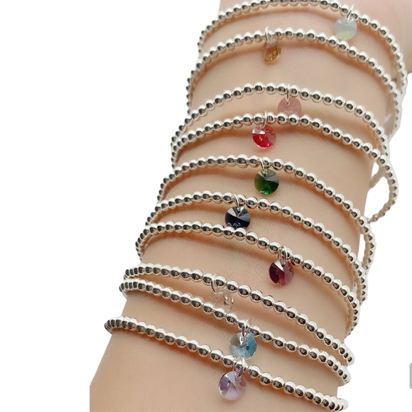 Adorn your wrist with this beautiful silver bracelet. Featuring a birthstone charm to add a personal touch, this accessory is a perfect way to spruce up any outfit. 