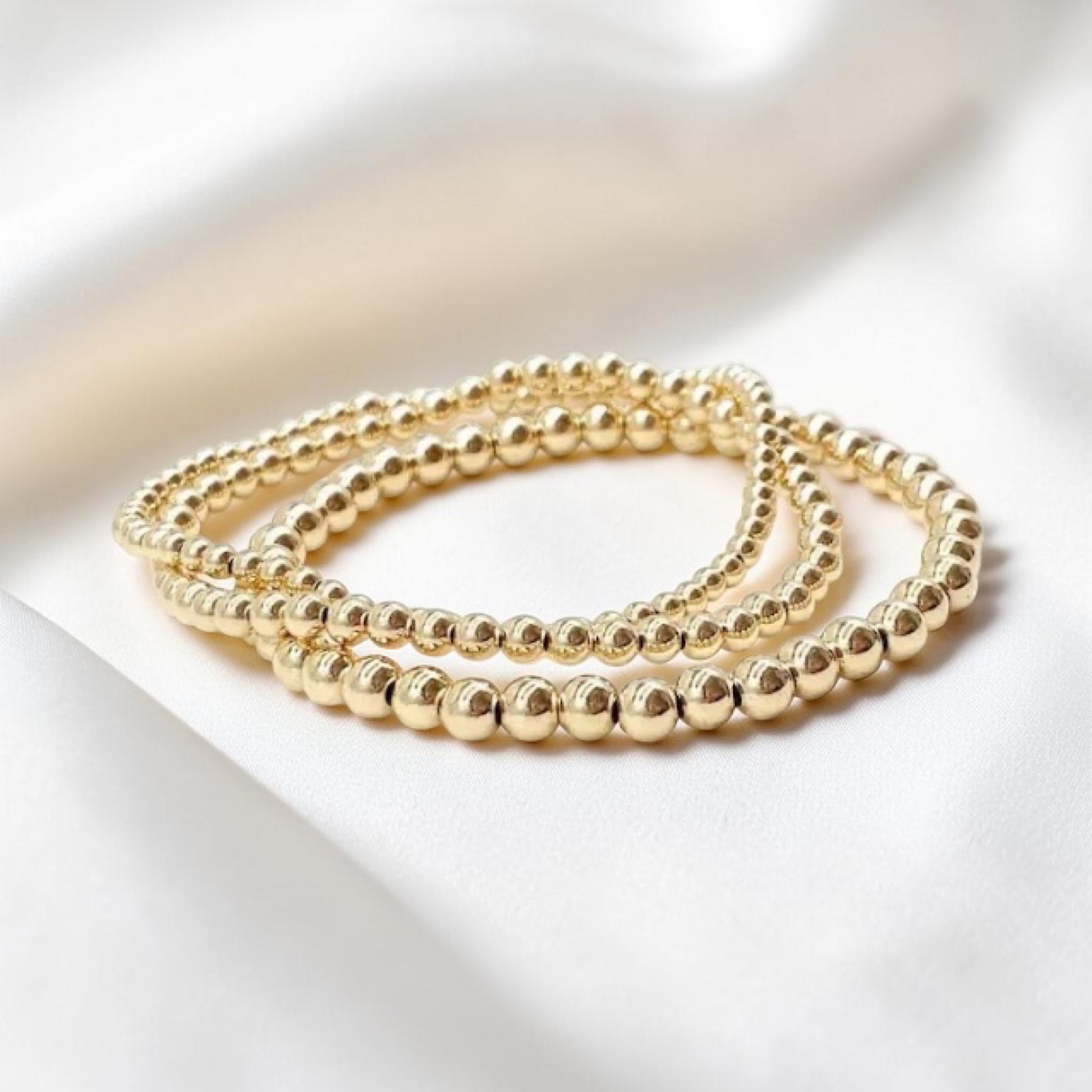 Gold Beaded Stretch Bracelet, made with 14k Gold Filled for lasting luxury. This best seller bracelet adds an elegant touch to any outfit.
