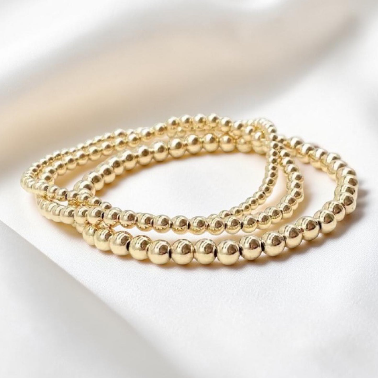 Gold Beaded Stretch Bracelet, made with 14k Gold Filled for lasting luxury. This best seller bracelet adds an elegant touch to any outfit,