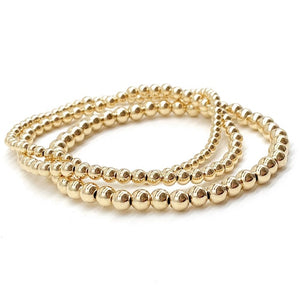 Indulge in sophistication with our Gold Beaded Stretch Bracelet, made with 14k Gold Filled for lasting luxury. This best seller bracelet adds an elegant touch to any outfit, perfect for those seeking a timeless and exclusive accessory. Elevate your style with this must-have piece.