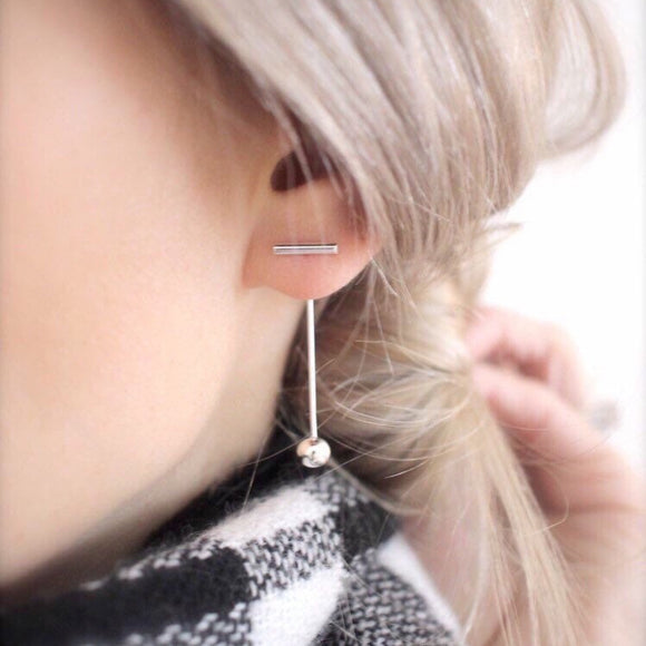 These beautiful Silver Bar Earrings will instantly add a touch of modern elegance and sparkle to any outfit. Designed with delicate curves to move gracefully with the wearer, they are sure to become a timeless staple in your jewelry collection!