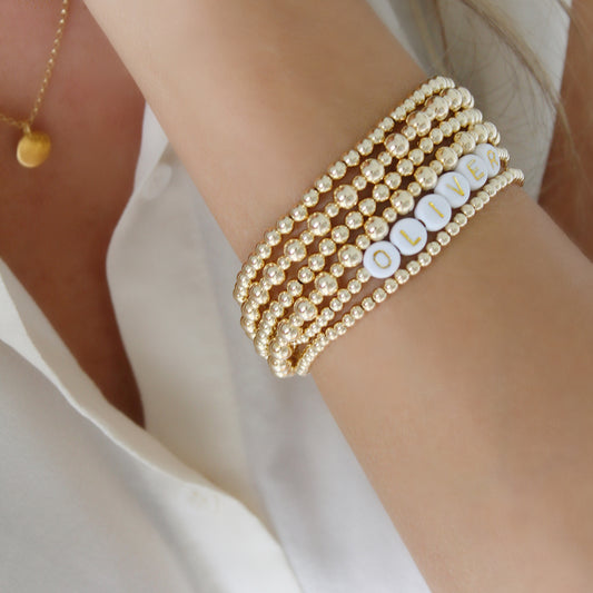 This beautiful gold bracelet is the perfect way to add a personalized touch to your accessory collection. It's crafted with high-quality 14k gold filled and features an Initial or name of your choice for a polished, sophisticated look