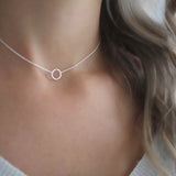 Discover the sparkle of the Dainty Sterling Silver Choker necklace. This delicate and mesmerizing choker necklace features elegant silver tones to perfectly accent any style. Let your beauty and confidence shine with this stunning piece to bring your look together.