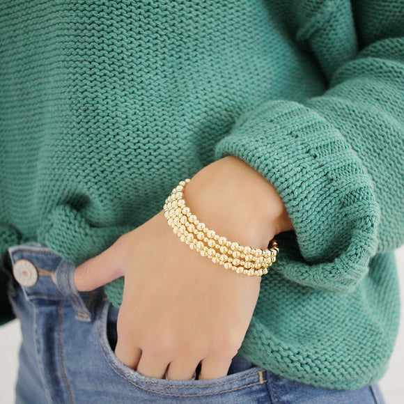 This exquisite Gold filled Bead bracelet adds a chic elegance to any look. Crafted from long-lasting 14k gold filled, this bracelet is sure to be a timeless addition to your wardrobe.